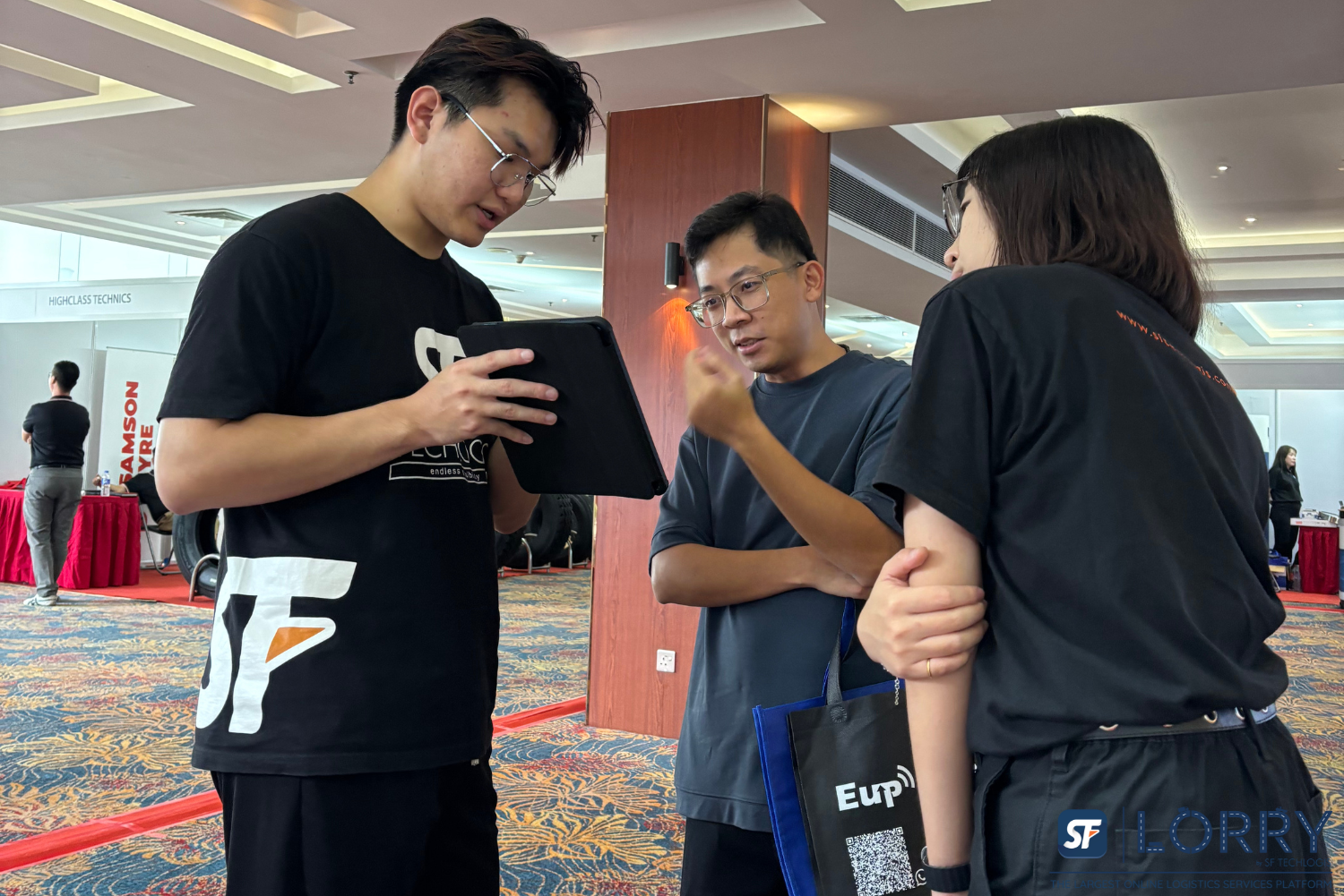 SF Lorry team presenting digital truck Malaysia solutions at Johor logistics exhibition 2024